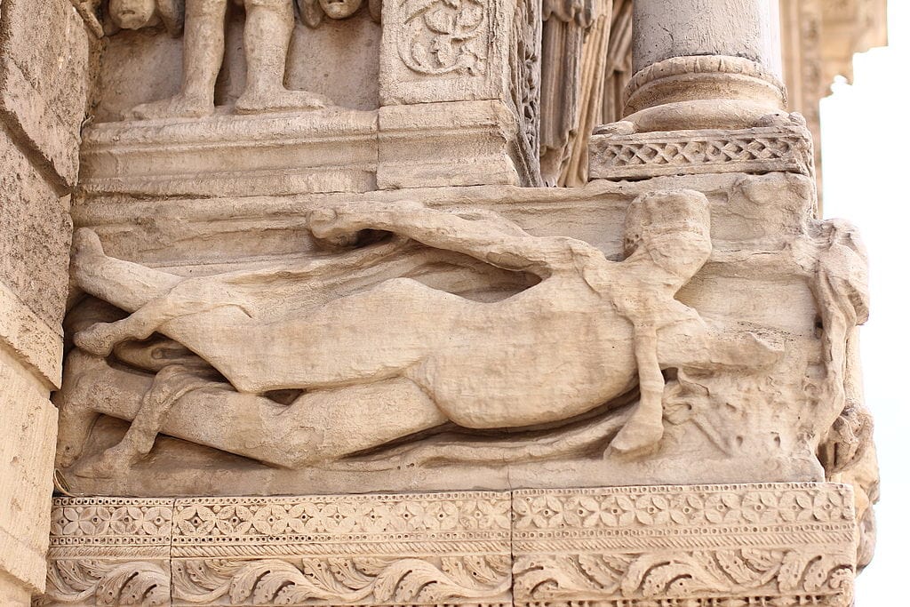 Ancient swimmer relief sculpture